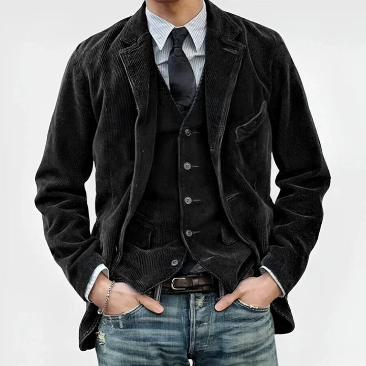 Jasper Retro Jacket & Vest worn by model, front view, dark corduroy jacket over a vest, with a tie and jeans