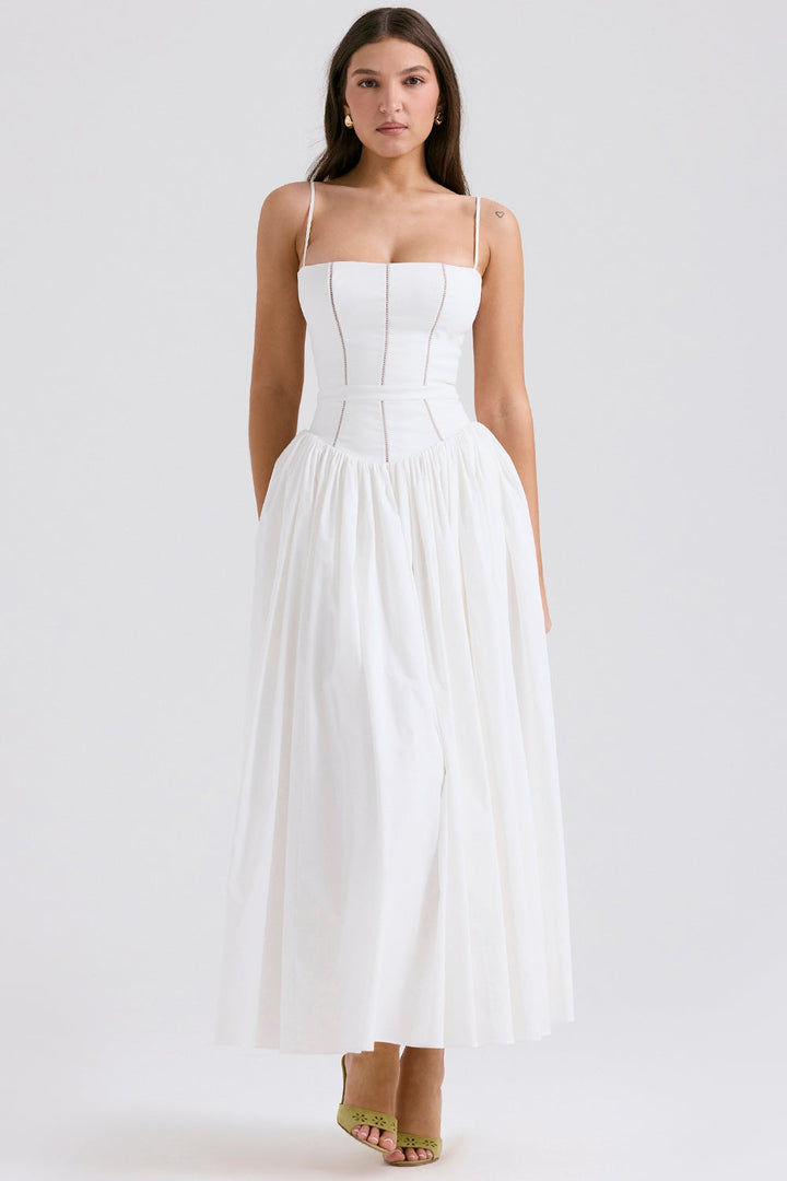 Front view, model wearing a white cotton maxi sundress with a structured bodice and fine shoulder straps