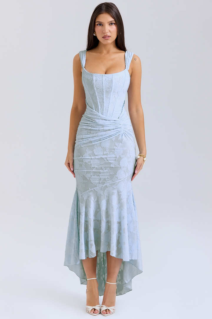 Front view, model wearing a light blue one-shoulder fishtail maxi dress with a bodycon fit and floral texture