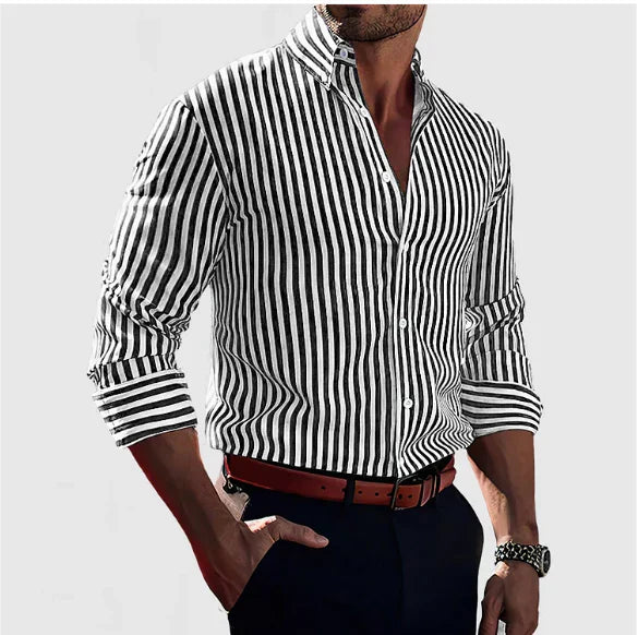 Three quarter view of a man wearing a black and white striped long sleeve shirt with a brown belt