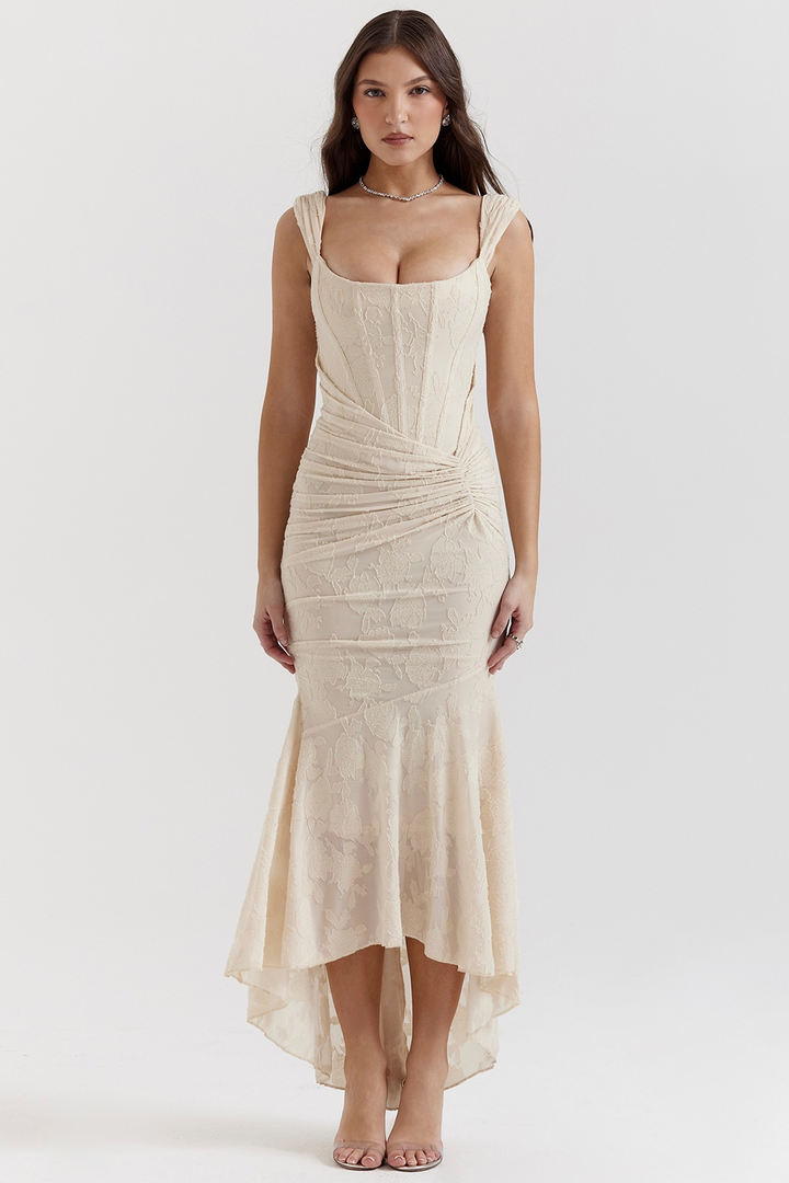 Front view, model wearing a cream one-shoulder fishtail maxi dress with a bodycon fit and floral texture