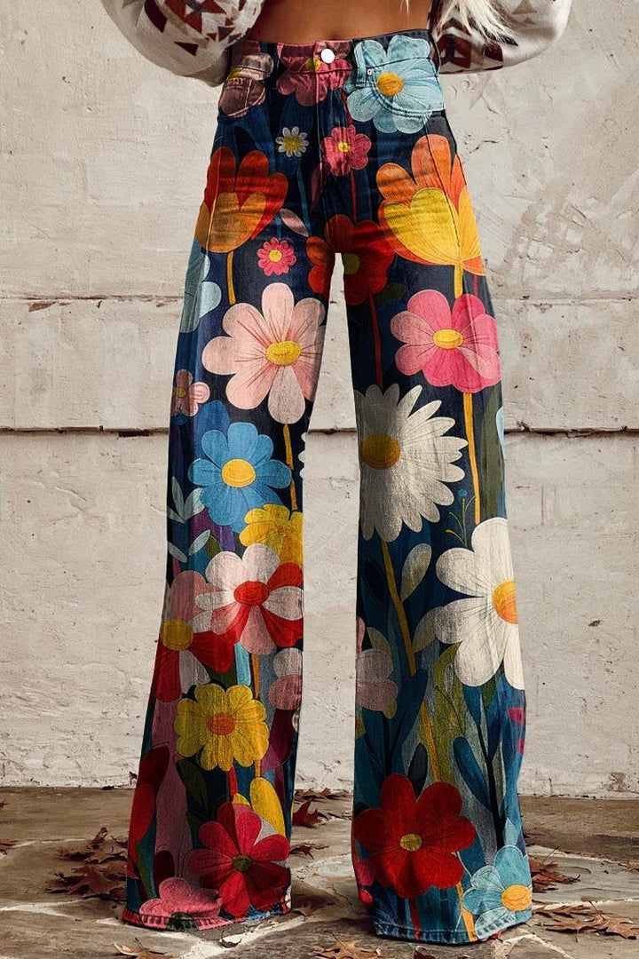 Front view of high-waisted wide leg boho vintage pants with a colourful floral pattern worn by model