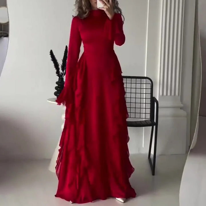 Front view of a model wearing the red elegant patchwork maxi dress with bell sleeves and side ruffles