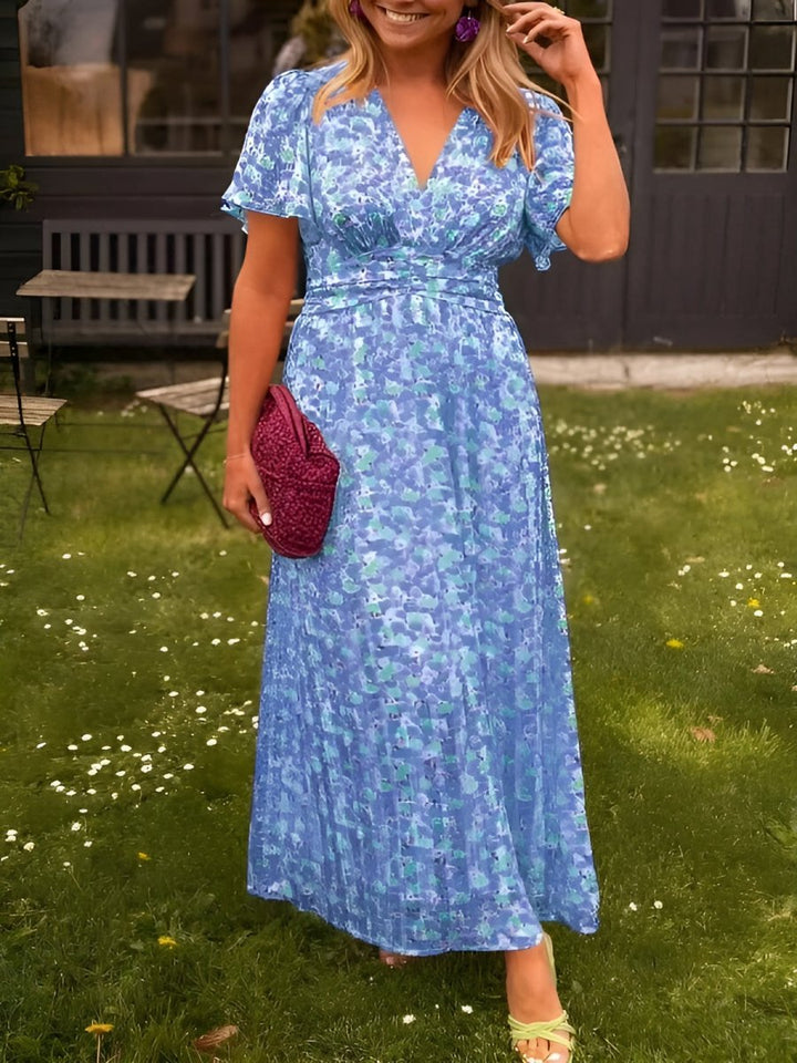 Front view of a model in a garden wearing a women&