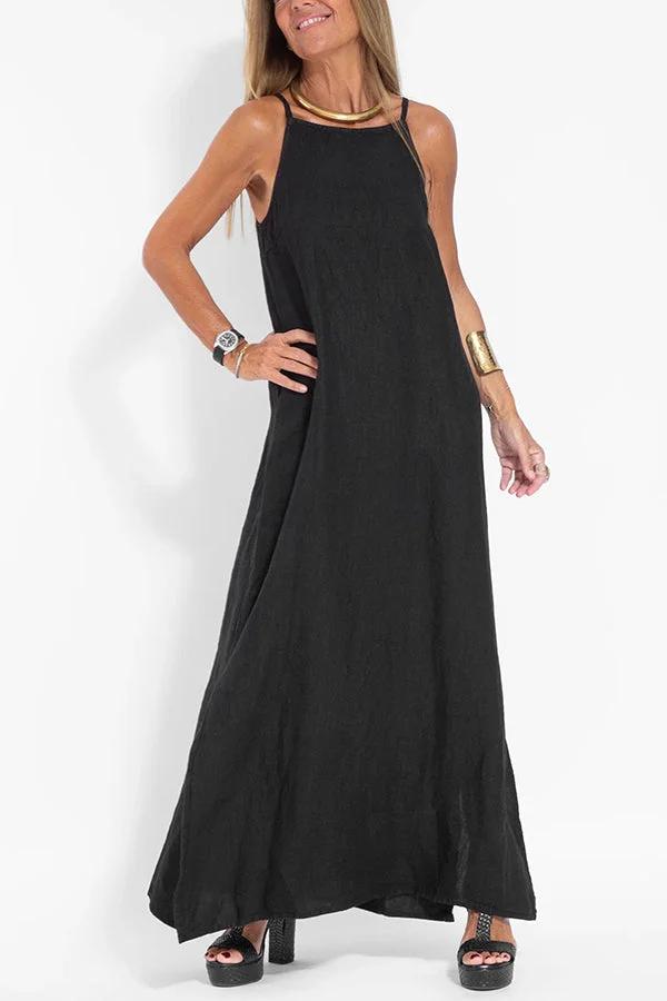 Front view, Ilaria elegant dress in black, worn by model with gold choker, watch and platform sandals