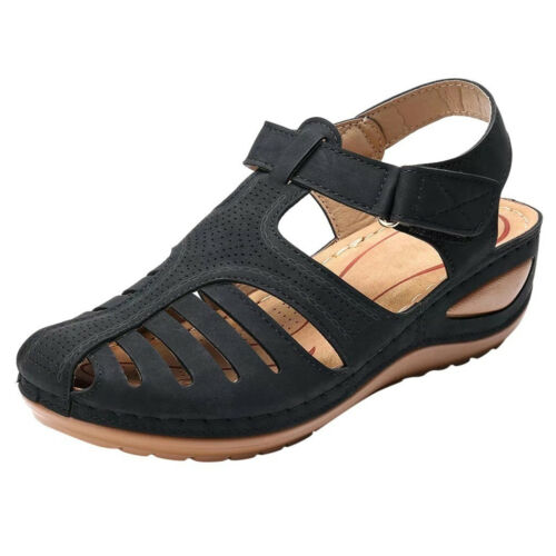 Side view of a black orthopedic summer sandal with cutouts, perforated detail, and a velcro strap