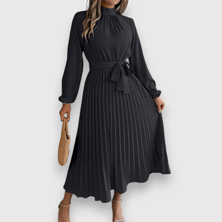 Malia Pleated Midi Dress, worn by model, front view, in black with a high neck and tie waist