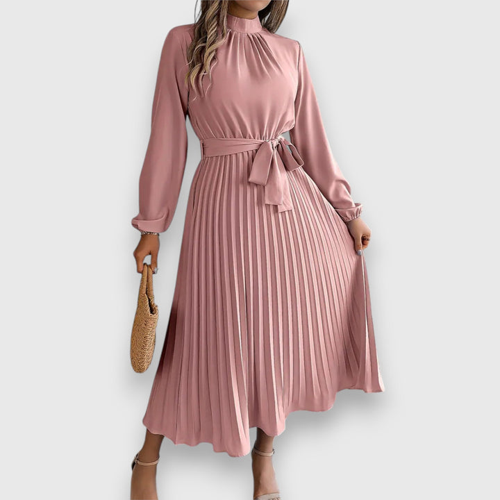 Malia Pleated Midi Dress, worn by model, front view, dusty pink with a high neck and tie waist
