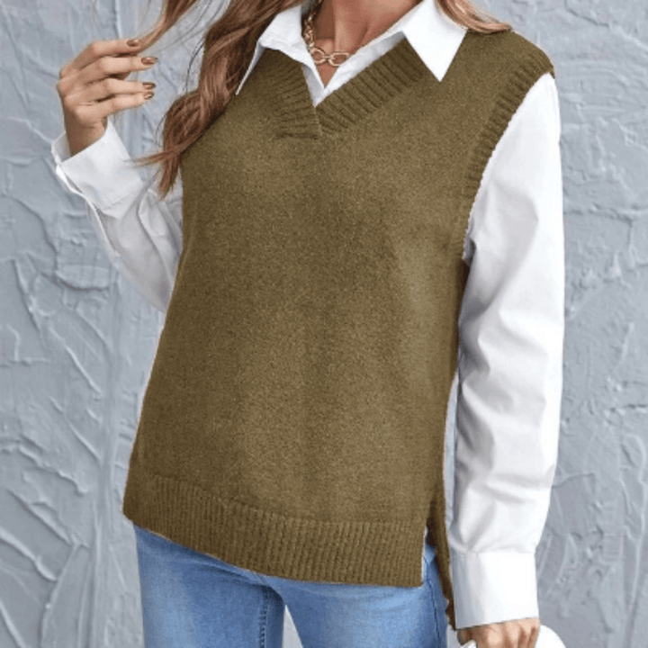 Olive green V neck knit vest with side splits over a white shirt