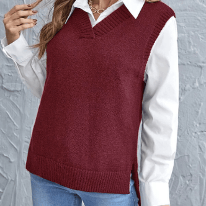 Front view of a model wearing a maroon V-neck knit sweater vest over a white collared shirt and blue jeans