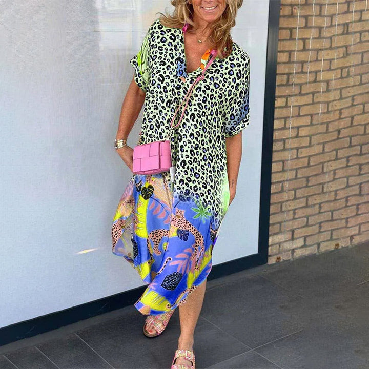 Front view of a model wearing a casual leopard print dress with a vibrant boho maxi skirt and pink cross body bag