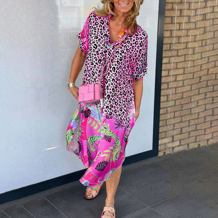 Worn by model, a casual leopard print dress with a vibrant boho maxi skirt and pink sliders, smiling