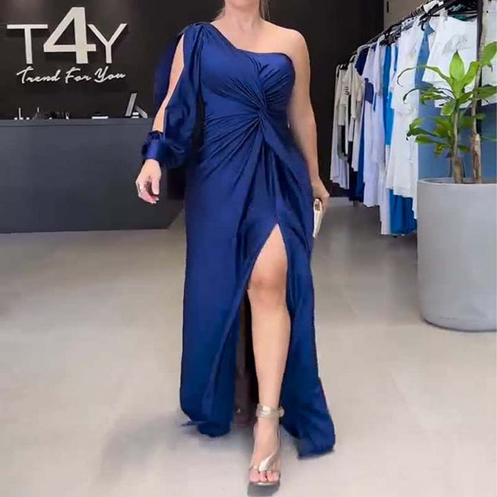 Worn by model, a navy one-shoulder maxi dress with a long sleeve, thigh split and elegant draped detailing, full length