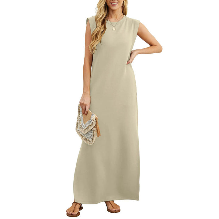 Front view worn by model, a beige crease-resistant maxi dress with a side slit and a statement clutch