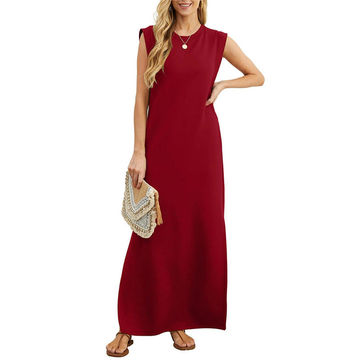 Front view worn by model, a red crease-resistant maxi dress with a round neck and brown sandals