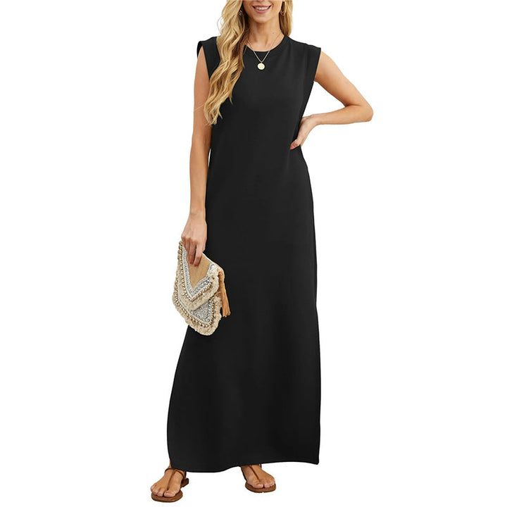 Front view worn by model, a black crease-resistant maxi dress with a side slit and a beaded clutch