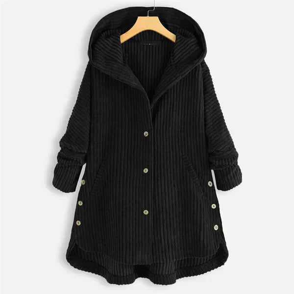 Front view of a black corduroy hooded button-up coat with pockets, rolled cuffs and side buttons on a hanger