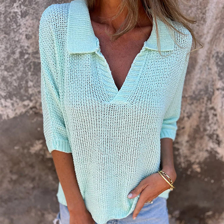 Front view worn by model, a woman in a mint green Lina V-neck top with a collared neckline and gold bracelet