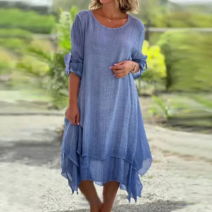 Front view, model wearing the blue double-layer elegant dress with a lightweight summer fabric