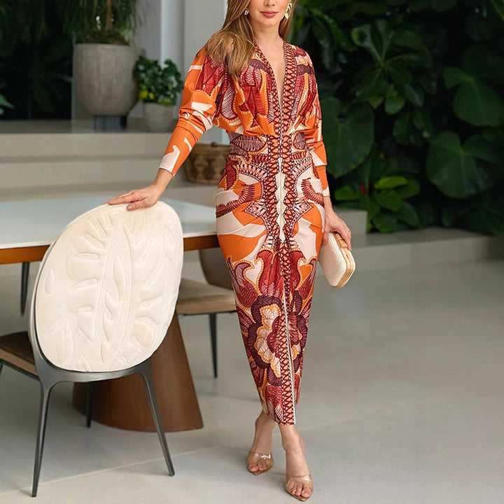Front view, model in an elegant V-neck bodycon dress, orange and white pattern, leaning on a chair
