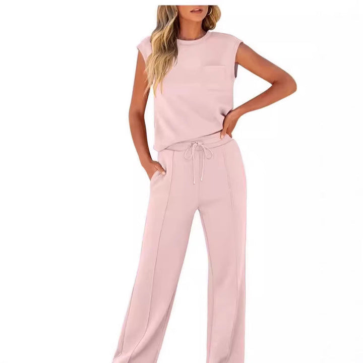 Front view worn by model, light pink sleeveless top and drawstring pants set with chest pocket