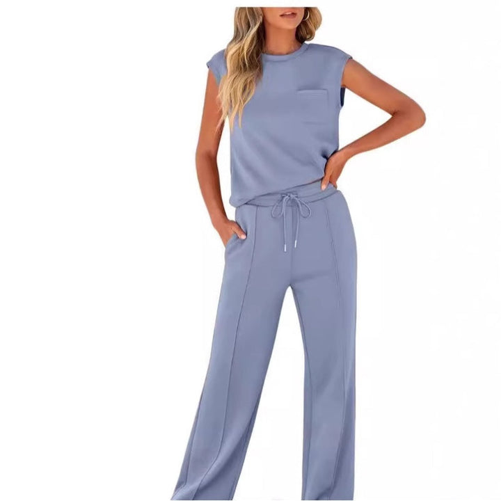 Front view worn by model, dusty blue sleeveless top and drawstring pants set with front pockets
