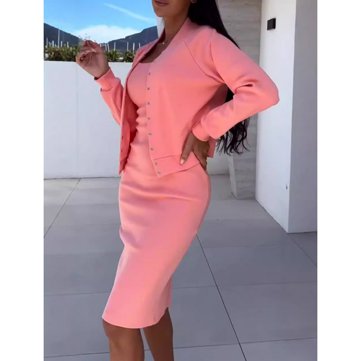 Side view of a model wearing a pink figure-hugging dress and jacket set with her hand on her hip