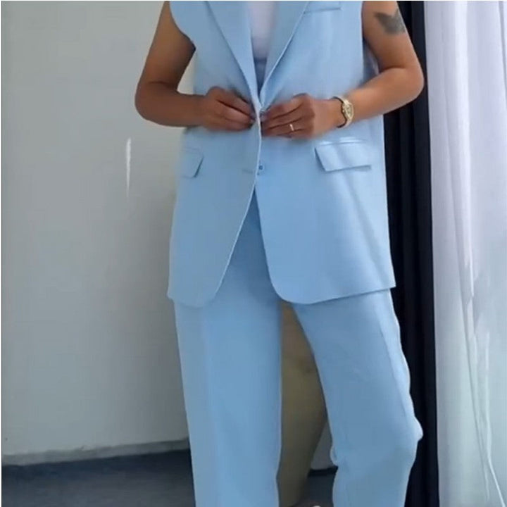 Sleeveless Blazer and High-Waisted Trousers Set worn by model, front view buttoning the blazer