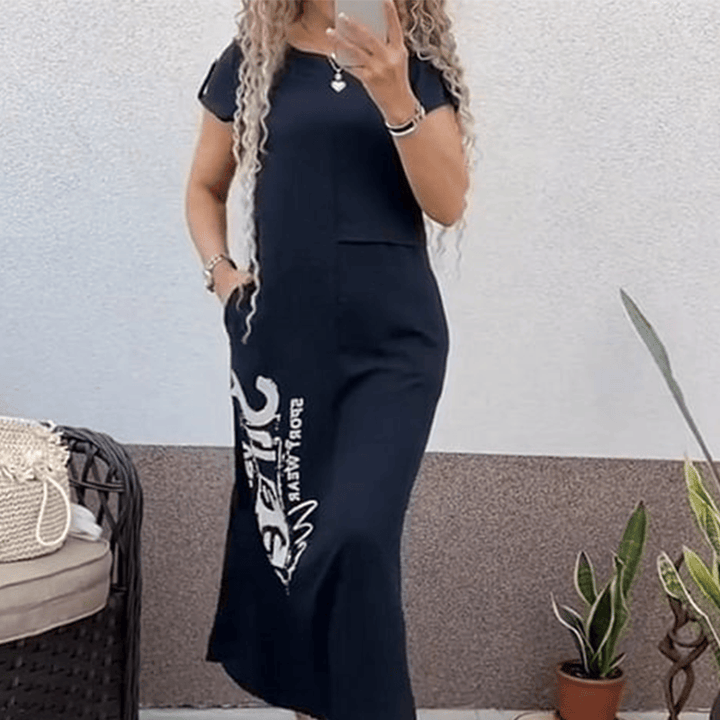 Side view of a model wearing a blue casual summer t-shirt dress with a white graphic print and side pocket