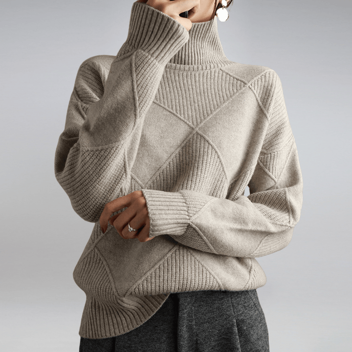 Three quarter view of a model wearing a cream check turtleneck knit sweater with textured diamond patterns