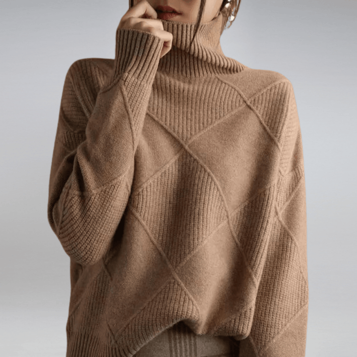 Close up of a model wearing a warm check turtleneck knit sweater with textured diamond patterns