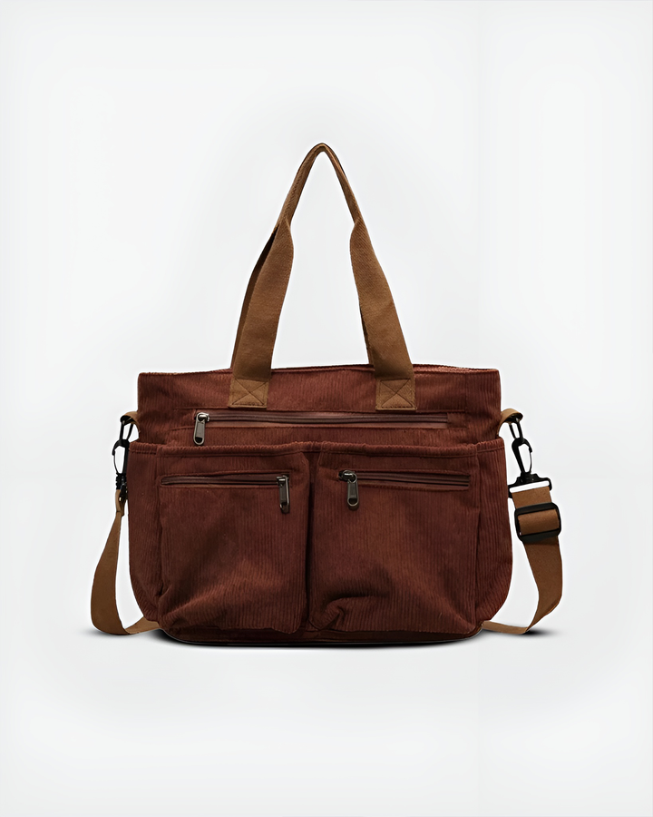 Front view of the Urban Cord Tote Bag in rich brown corduroy with multiple zippered pockets and a shoulder strap
