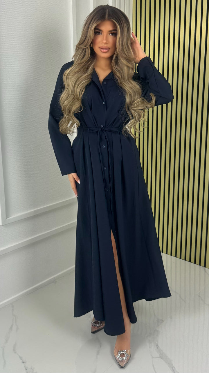 Navy blue maxi dress with a tie belt and front split, worn walking