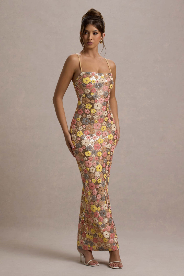 Front view, model wearing a floral sequin strapless maxi dress with thin straps and a form-fitting silhouette