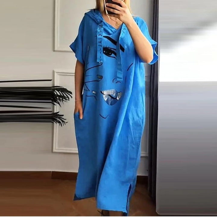Side view of a model wearing a blue retro abstract hooded dress with an art-inspired face print and pockets
