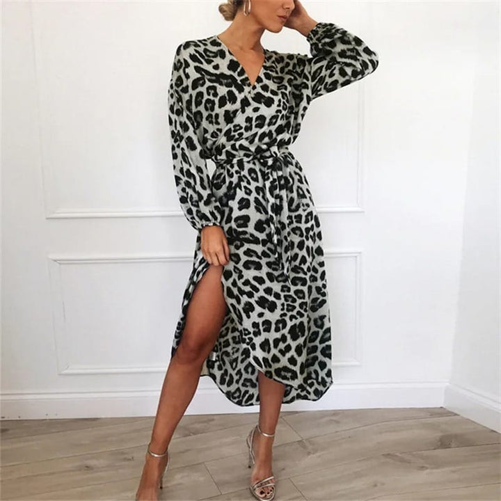 Full length view, model posing in a leopard print high-waist chiffon dress with a thigh-high split