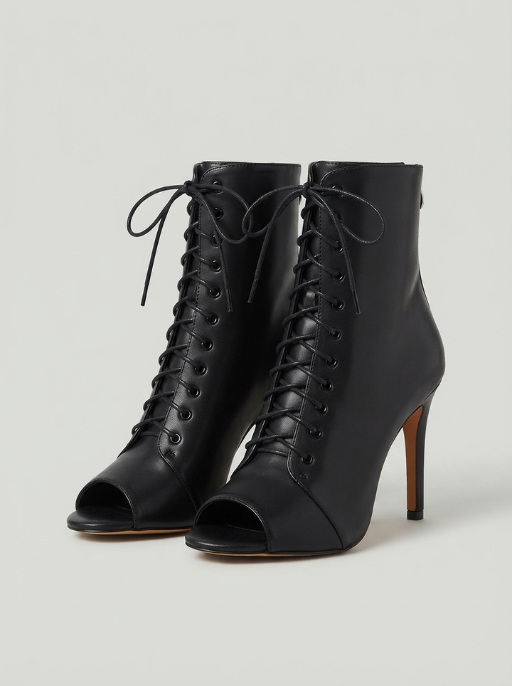 Black lace up ankle boots with an open toe, the pair seen from the front