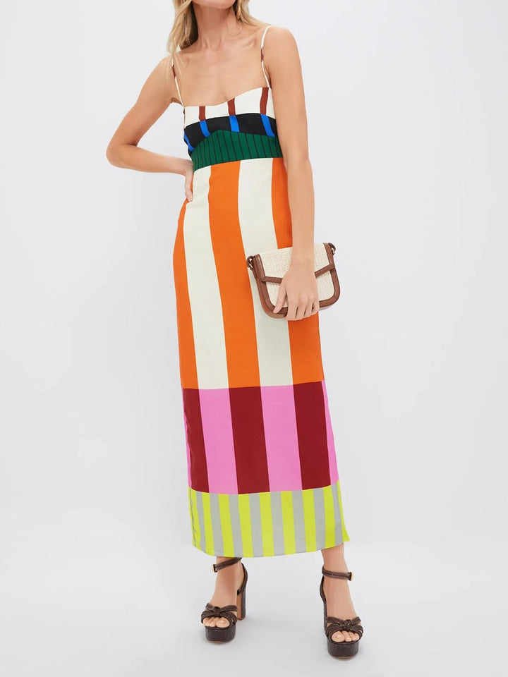 Three quarter view, Zola Multicolour Long Dress worn by model, showing the striped bodice and skirt with handbag