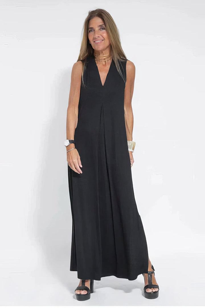 Front view, elegant maxi dress in black sculpting fabric with a deep V-neck worn by model