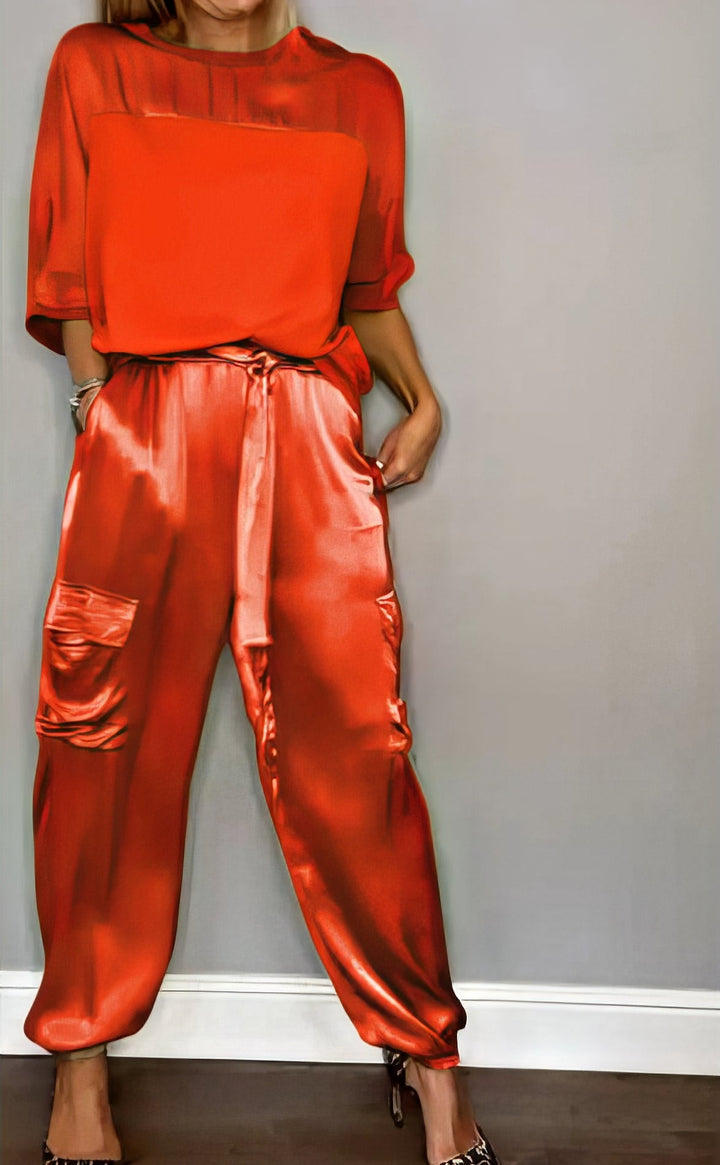 Jade Satin Two-Piece Set, worn by model, showing blouse and cargo trousers with tie waist and gathered side pockets