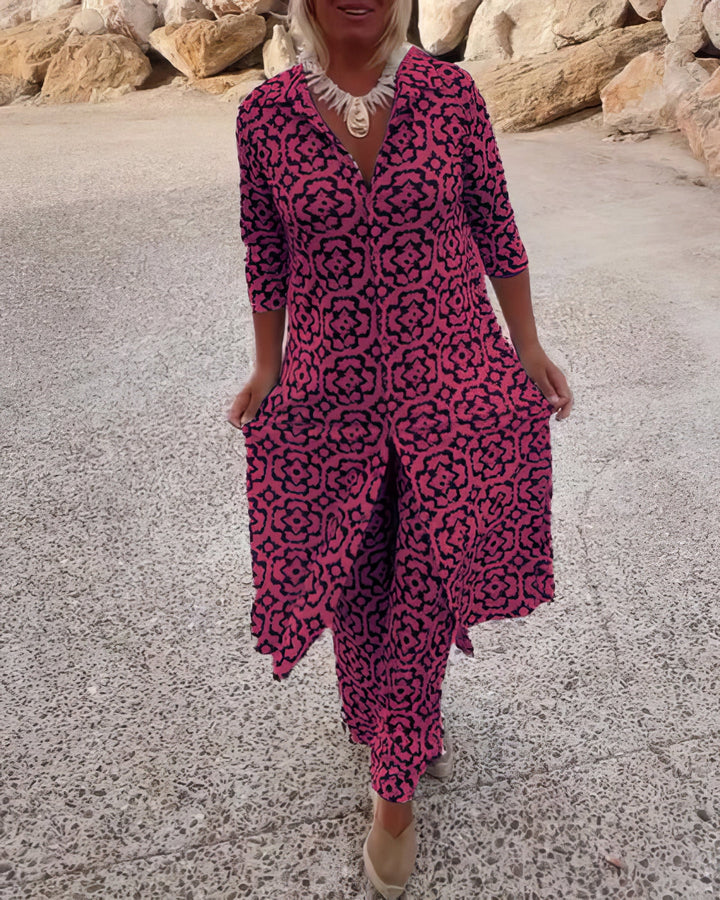 Front view worn by model, a geometric elegance two-piece set in pink and black with a long shirt and trousers