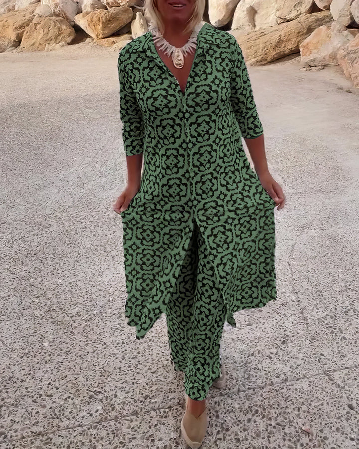 Three quarter view worn by model, a geometric elegance two-piece set in green and black with a long shirt and trousers