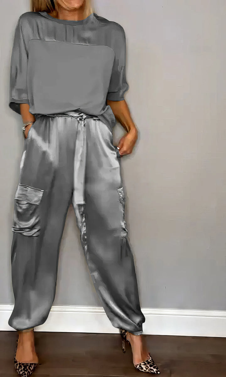 Jade Satin Two-Piece Set, worn by model, showing cargo trousers with side pockets and gathered ankle cuffs