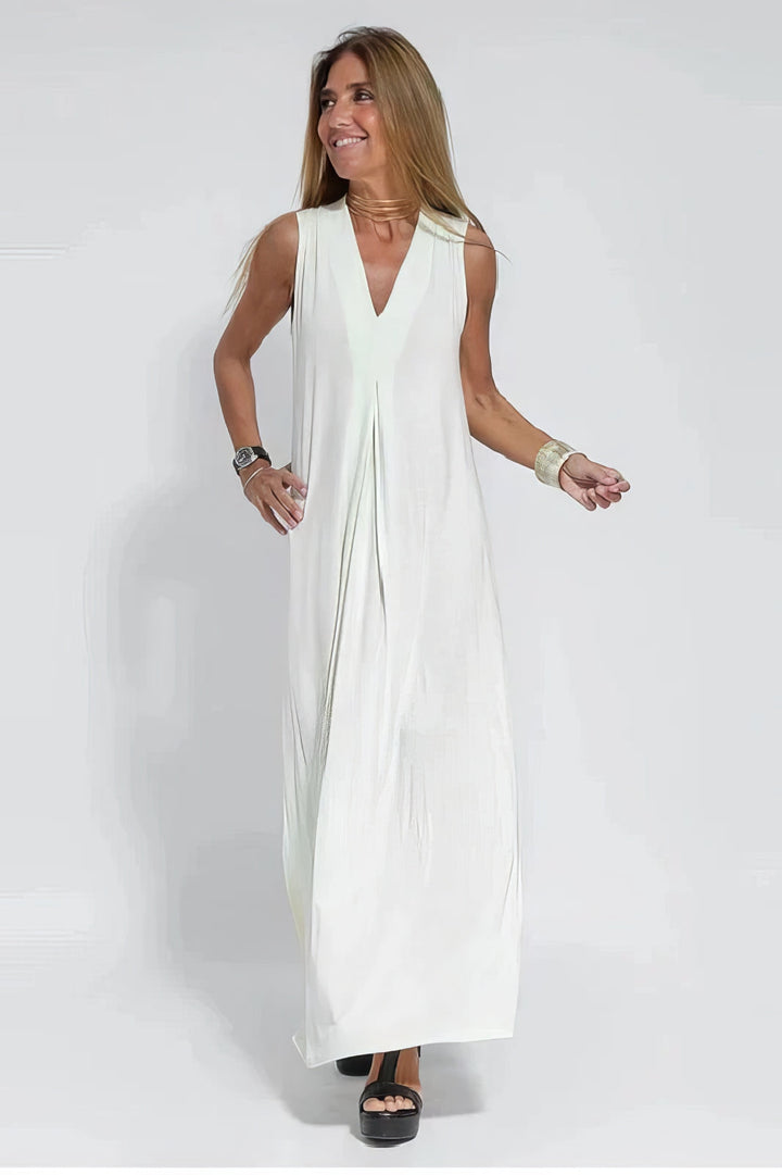 Front view, elegant maxi dress in white sculpting fabric with a deep V-neck worn by model