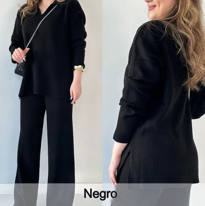 Front and back view of a model wearing a black ribbed V-neck sweater and wide-leg trousers set