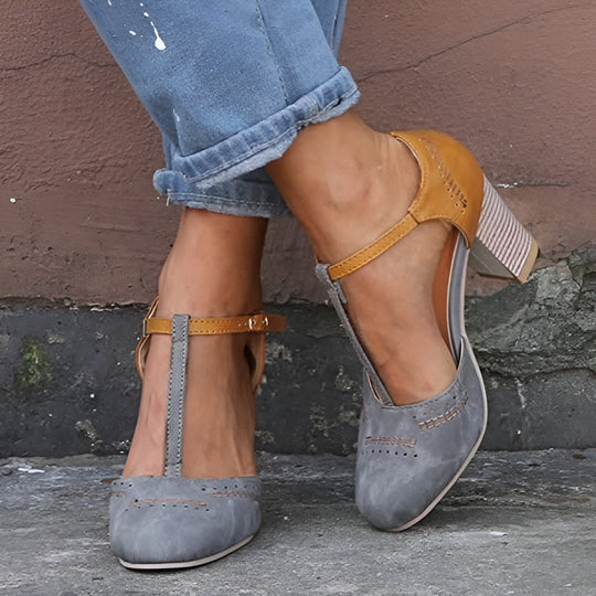 Grey and tan suede T-bar block heel shoes worn with cuffed jeans