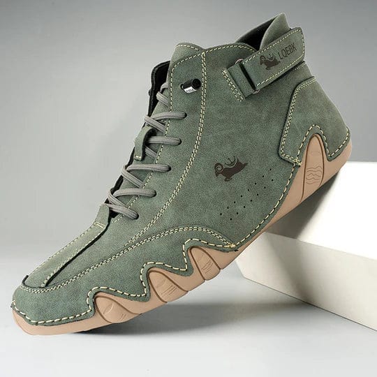 Side view of a green Orthopedic Comfort Boot with beige anti-slip sole and grey laces, on a display stand