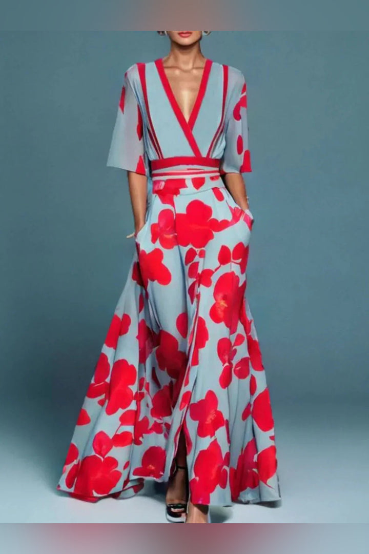 Front view of a model wearing the Yasmine elegant puff sleeve dress in light blue with red floral print