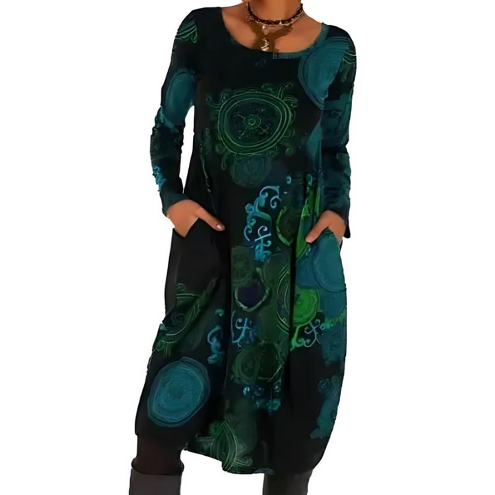 Front view of a bohemian long sleeve winter dress with pockets, featuring green and blue abstract patterns