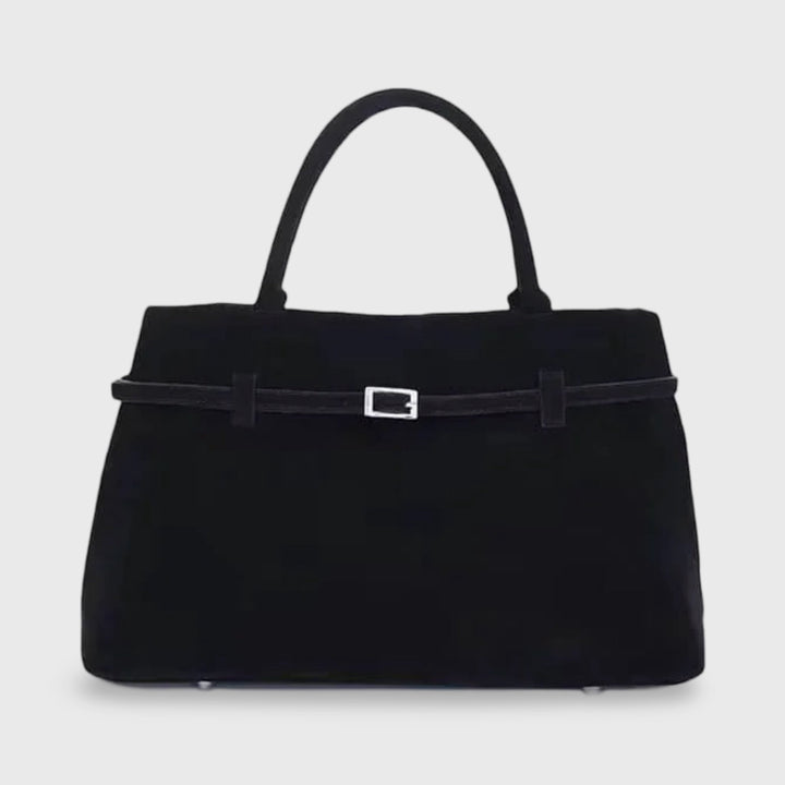 Front view of the black suede Sara handbag with a silver buckle detail on a strap